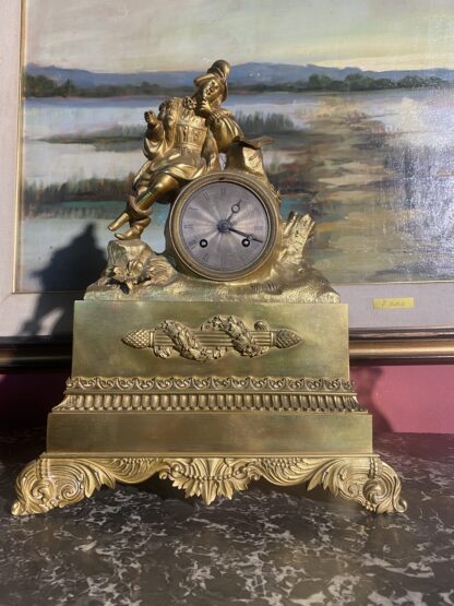 Orologio in bronzo dorato  con quadrante in argento del XIX secolo